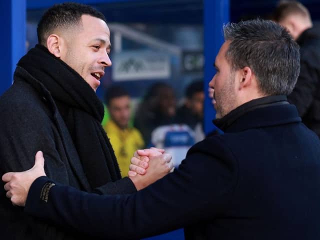 NEXT GENERATION: Hull City's Liam Rosenior shakes hands with Queens Park Rangers' new Spanish coach Marti Cifuentes, who is 41