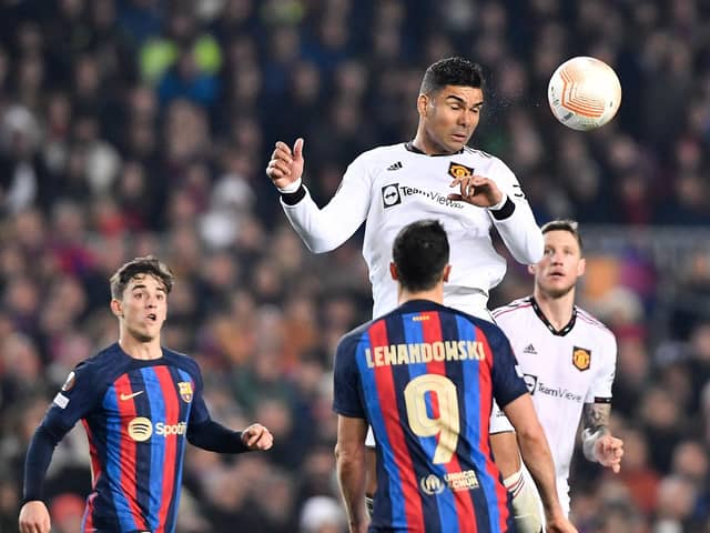 Manchester United's Brazilian midfielder Casemiro heads the ball during the UEFA Europa League round of 32 first-leg football match between FC Barcelona and Manchester United (Picture: PAU BARRENA/AFP via Getty Images)