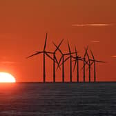 The sun sets behind the Burbo Bank Offshore Wind Farm in Liverpool Bay in the Irish Sea in north west England on May 26, 2021. PIC: PAUL ELLIS/AFP via Getty Images