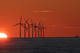 The sun sets behind the Burbo Bank Offshore Wind Farm in Liverpool Bay in the Irish Sea in north west England on May 26, 2021. PIC: PAUL ELLIS/AFP via Getty Images