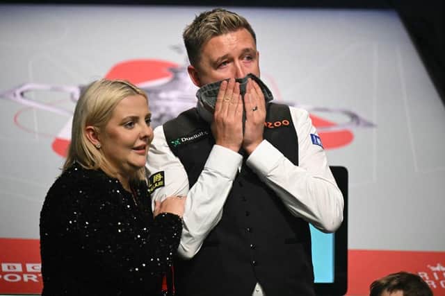 England's Kyren Wilson reacts beside his wife Sophie after victory over Wales' Jak Jones on day two of their World Championship Snooker final at The Crucible in Sheffield, northern England on May 6, 2024. Wilson won the final 18-14. (Photo by OLI SCARFF/AFP via Getty Images)
