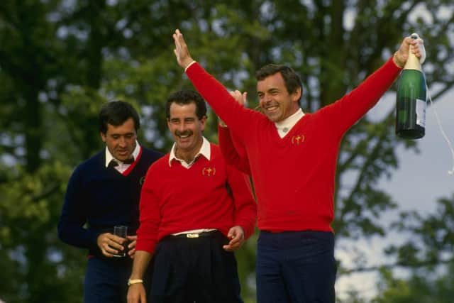 A watershed moment: Tony Jacklin says he can't walk past that rooftop at the Belfry without thinking back to the celebrations he enjoyed with the victorious European Ryder Cup team in 1985, including Seve Ballesteros (left) of Spain and Sam Torrance (centre) of Scotland (Picture: Simon Bruty/Allsport)