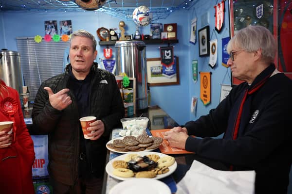 Keir Starmer Campaigns talks to Glenis Haynes in Dale's Bar as he Campaigns With Labour's By-election Candidate Gen Kitchen at AFC Rushden & Diamonds on February 13, 2024 in Rushden, England. (Photo by Eddie Keogh/Getty Images)