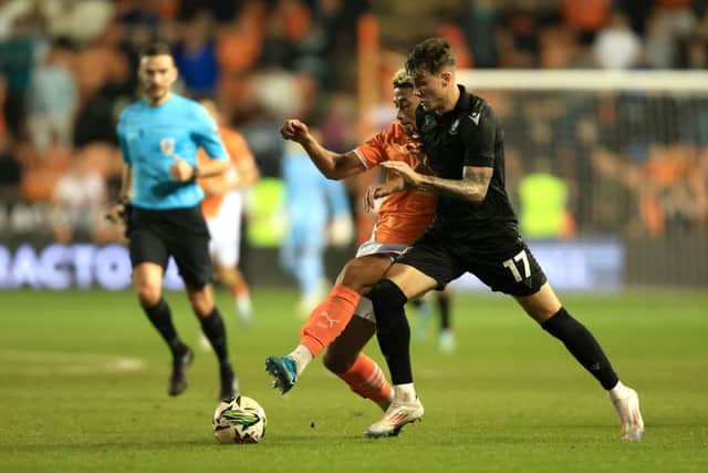 NEED MINUTES: Charlie McNeill in League Cup action for Sheffield Wednesday at Blackpool