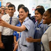 Prime Minister Rishi Sunak with members of staff in the SDEC, same day emergency care unit during a visit to Milton Keynes University Hospital, Milton Keynes.