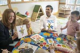 Prime Minister Rishi Sunak and Education Secretary Gillian Keegan hold images of bees they created during a visit to the Busy Bees nursery in Harrogate, North Yorkshire, on August 21, 2023. (Photo by Danny Lawson - WPA Pool/Getty Images)