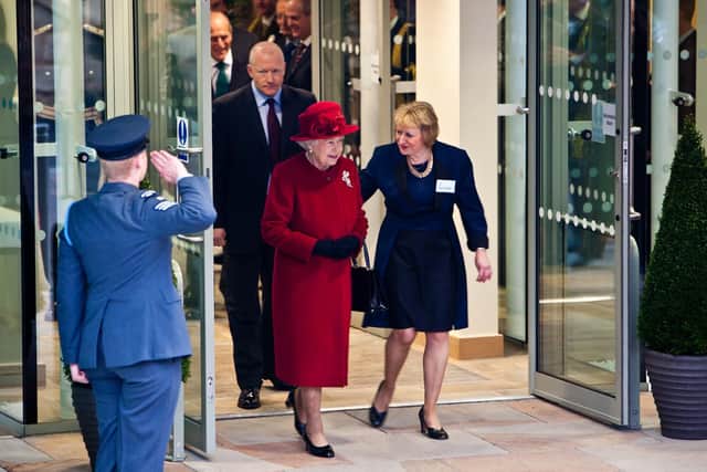 Dame Pamela Shaw shows the Queen around in 2010.