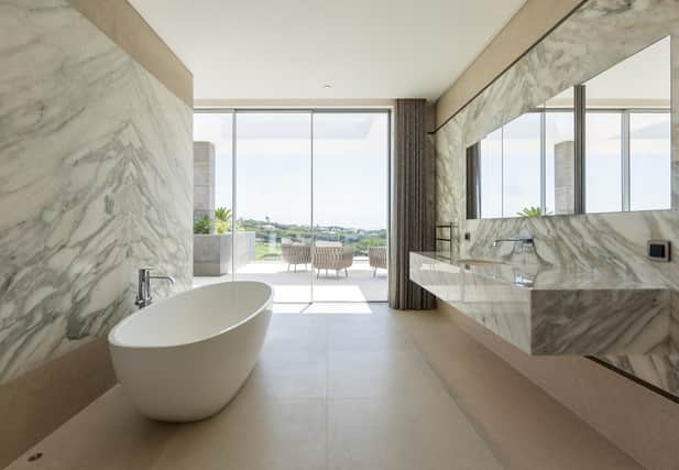 Create statement walls and floors using bookmatched marble or porcelain for the ultimate in luxury