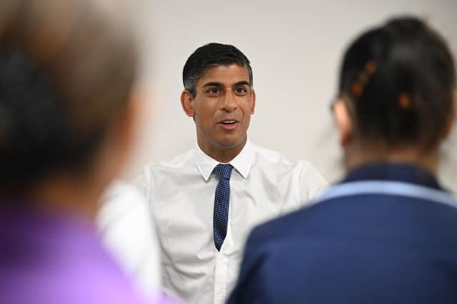 Prime Minister Rishi Sunak speaks to staff during a visit to Milton Keynes University Hospital. PIC: Leon Neal/PA Wire