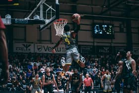 Slam dunk: Jalon Pipkins soars through the air to score two points for Sheffield Sharks (Picture: Adam Bates)