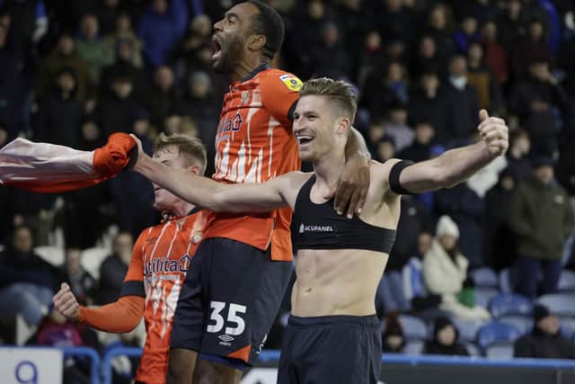 Luton Town's Reece Burke (right) celebrates scoring his sides second goal of the game during the Sky Bet Championship match at the John Smith's Stadium, Huddersfield. Picture: Richard Sellers/PA