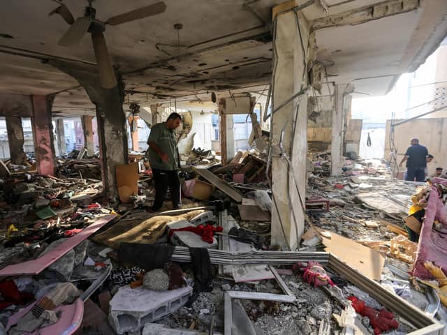 People search through buildings that were destroyed during Israeli air raids in the southern Gaza Strip, November 3, 2023. PIC: Ahmad Hasaballah/Getty Images