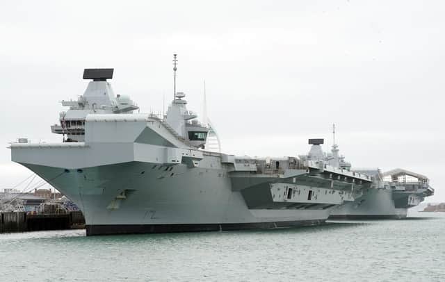 HMS Queen Elizabeth's departure from Portsmouth was delayed today. She is due to sail to Rosyth in Scotland to fix a mechanical fault discovered in February, before she was due to join Nato allies on Exercise Steadfast Defender.
