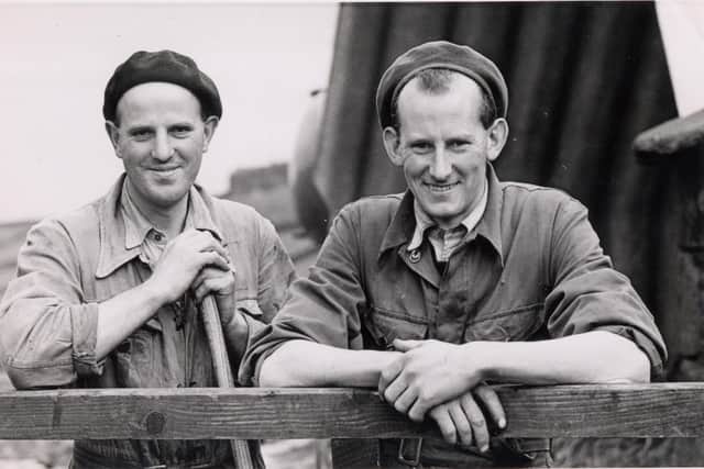 Joseph Dickinson, left, and Edgar Dickinson in front of the grass dryer at Longley Farm in 1954. Picture supplied by Longley Farm