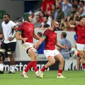GROW THE GAME: Portugal's players celebrate after victory over Fiji at the Stade de Toulouse last Sunday. Picture: CHARLY TRIBALLEAU/AFP/Getty Images