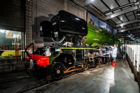 The world famous locomotive, The Flying Scotsman has arrived at the National Railway Museum York as part of it's Centenary Celebration. Pictured Joshua Chapman, from the  National Railway Museum York, making sure the area around this special train is clean in readiness for it's view to the public on Saturday 1st April