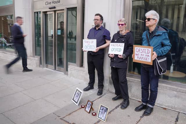 People attend a vigil for Ruth Perry outside the offices of Ofsted in Victoria, central London, after she took her own life while waiting for a negative Ofsted inspection report. PIC: PA