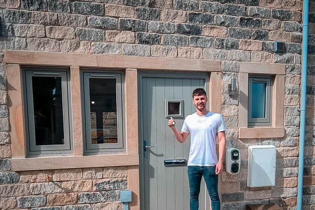 Luke Brooker with the keys to the door of his first homes
