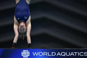Head over heels: Britain's Lois Toulson in a handstand 10 metres above the pool during the final of the women's 10m platform diving event during the World Aquatics Championships in Fukuoka on July 19, 2023. (Picture: YUICHI YAMAZAKI/AFP via Getty Images)