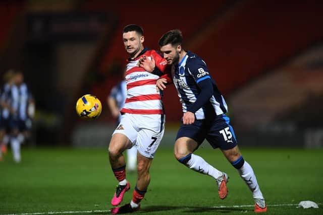 Doncaster Rovers' winger Luke Molyneux battles with Stockport County's Ethan Pye in the League One game at the Eco-Power Stadium in December. Picture: Jonathan Gawthorpe