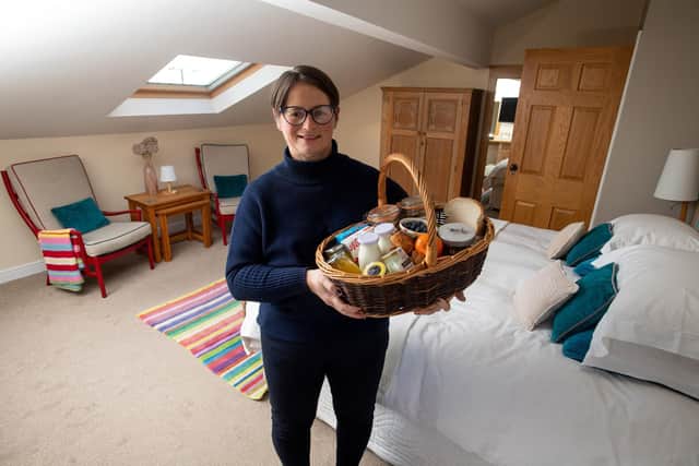 Lisa Preston, Pickersgill Manor Farm, regional director of Farmstay UK, in one of the frms B&B rooms with a breakfast basket.