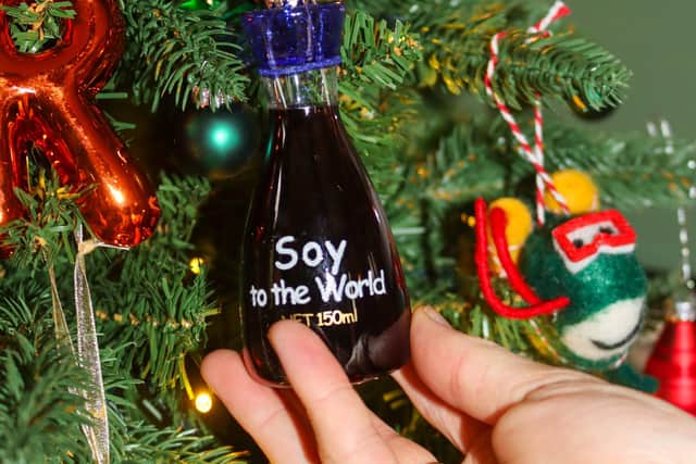 Wil Law's tree reflects the things he loves best - this soy to the world tree decoration is £8 from John Lewis