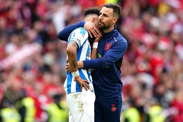 Huddersfield Town Narcis 'Chico' Pelach (right) consoles their players after defeat in the Sky Bet Championship play-off final at Wembley Stadium, London. Picture date: Sunday May 29, 2022. PA Photo. See PA story SOCCER Championship. Photo credit should read: John Walton/PA Wire. 

RESTRICTIONS: EDITORIAL USE ONLY No use with unauthorised audio, video, data, fixture lists, club/league logos or "live" services. Online in-match use limited to 120 images, no video emulation. No use in betting, games or single club/league/player publications.