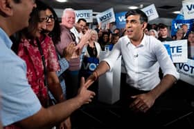 Prime Minister Rishi Sunak (right) while on the General Election campaign trail. PIC: Aaron Chown/PA Wire