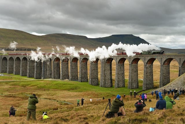 The Flying Scotsman crossed the Ribblehead Viaduct in the shadow of Ingleborough, on its  journey from Oxenhope to Carlisle to celebrate the re-opening of the Settle Carlisle Railway line on March 31, 2017.