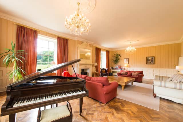 The piano room with a Baby Grand