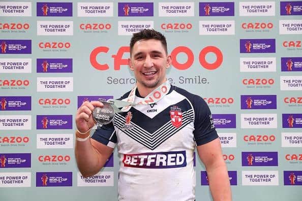 Victor Radley poses with the man of the match award after the win over Samoa. (Photo by Alex Livesey/Getty Images for RLWC)