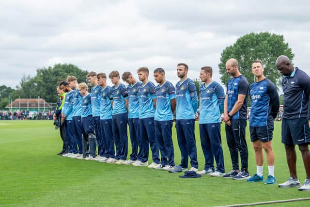 Yorkshire players line up for a minute's silence at York on August 17, 2023, to remember Sir Michael Parkinson who has died (Picture: Allan McKenzie/SWpix.com)