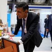Prime Minister Rishi Sunak tours the Exhibitor's Hall, at the Manchester Central convention complex, during the Conservative Party annual conference. PIC: Carl Court/PA Wire