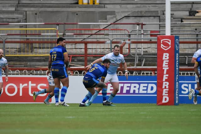 Wakefield Trinity hooker Liam Hood attacks the Featherstone Rovers line. (Picture: Rob Hare)