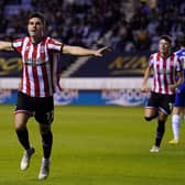 TEAMWORK: Sheffield United's John Egan celebrates scoring his side's first goal of the game at the DW Stadium against hosts Wigan Athletic. Picture: Tim Goode/PA