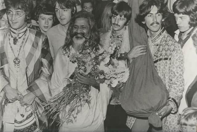 The Beatles, accompanied by the Maharishi and Mick Jagger, arriving at Bangor railway station in Gwynedd, North Wales on 25 August, 1967. (Bob Hewitt)