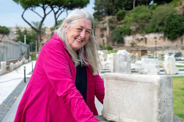 Mary Beard with the tombstone of Nero's nanny, Claudia Egloge, Rome. Picture: BBC/Lion Television/Russell Barnes.