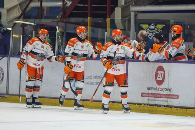 RETURN TO ACTION: Sheffield Steelers' players congratulate each other after Robert Dowd's goal ion the 4-1 win at Manchester Storm. Picture courtesy of Mark Ferris/EIHL Media.
