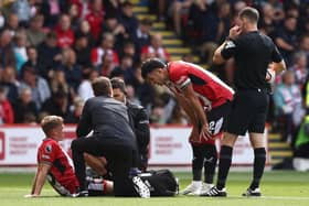 TURNING POINT: Sheffield United's Ben Osborn receives treatment during Sunday's game against Manchester City
