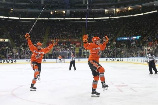 Treble triumph: Sheffield Steelers players celebrate on the ice in Nottingham after clinching the Elite League play-off title, their third trophy of the season (Picture: Dean Woolley)