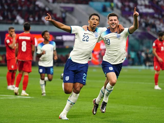STARTING POINT: England's Jude Bellingham celebrates scoring his side's opening goal of the game against Iran with team-mate Mason Mount during the World Cup Group B match at the Khalifa International Stadium. Picture: Mike Egerton/PA