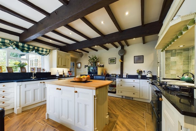 The property’s kitchen is accessed through a stable door, immediately highlighting the beautiful countryside background.