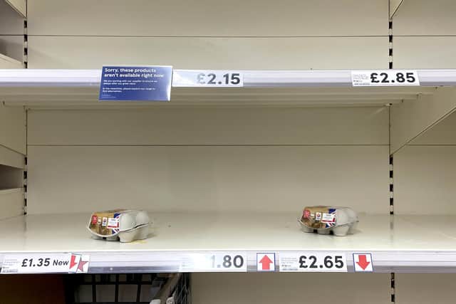 Empty egg shelves in a Tesco store in Ashford, Kent. Tesco has joined other supermarkets in limiting the number of boxes of eggs customers can buy as the impacts of rising costs and bird flu continue to take their toll.