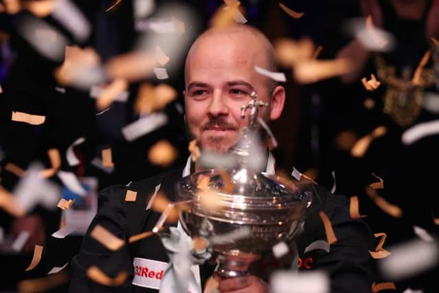 Luca Brecel of Belgium celebrates with the Cazoo World Snooker Championship trophy. (Photo by George Wood/Getty Images)