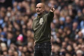 Manchester City's Spanish manager Pep Guardiola gestures on the touchline during the English Premier League football match between Manchester City and Brentford at the Etihad Stadium in Manchester, north west England, on November 12, 2022. (Photo by OLI SCARFF/AFP via Getty Images)