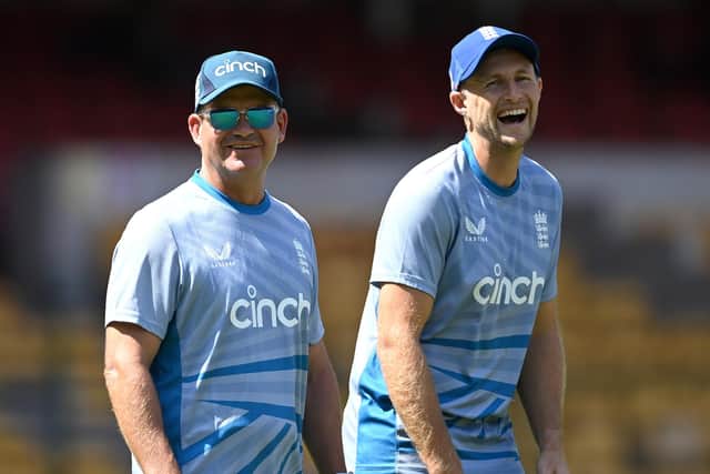 NO LAUGHING MATTER: England's Joe Root shares a joke with coach Matthew Mott during nets session earlier this week - but that was before Thursday's abysmal capitulation against Sri Lanka which has left their World Cup hopes hanging by a thread ahead of Sunday's clash with hosts India. Picture: Gareth Copley/Getty Images