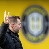 Threes-y does it for delighted Harrogate Town boss Simon Weaver after his side's League Two derby victory over Bradford City. Picture: Tony Johnson.