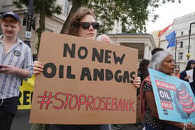 People take part during a protest in central London after the controversial Equinor Rosebank North Sea oil field was given the go-ahead. PIC: Lucy North/PA Wire