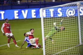 Breakthrough: Mallik Wilks forces the equalising goal for Sheffield Wednesday that booked an FA Cup fourth-round replay with Fleetwood Town. (Picture: Steve Ellis)