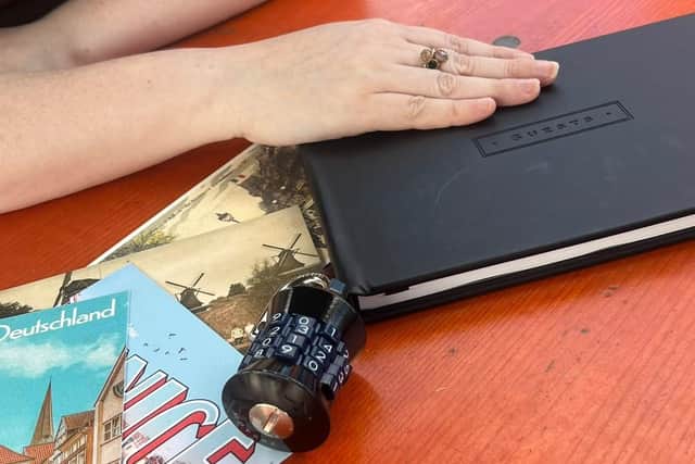 Participants get their hands on the the Race Across the World experience guest book at the end of the game.